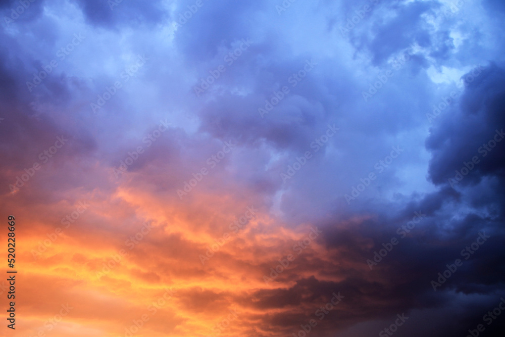 Colorful clouds on dark blue sky