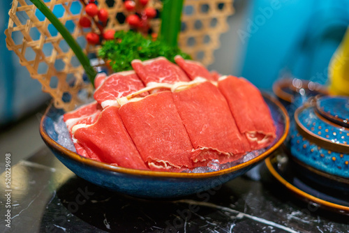 Raw beef slice for hot pot, fresh snowflake beef slices, chinese food. Selective focus.