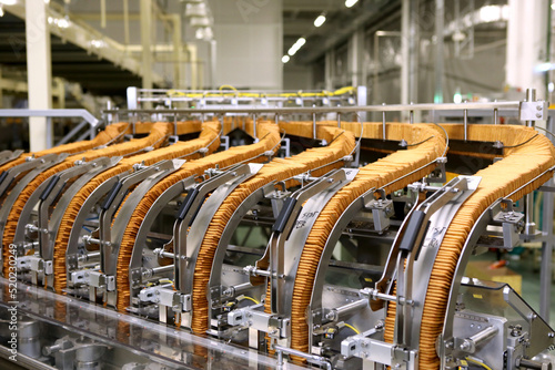 A lot of cookies on the production line. The flow of sweets before packaging. Packing crackers on the machine. Innovative production.