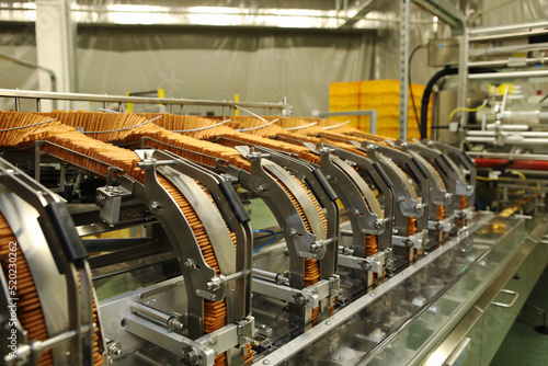 A lot of cookies on the production line. The flow of sweets before packaging. Packing crackers on the machine. Innovative production.