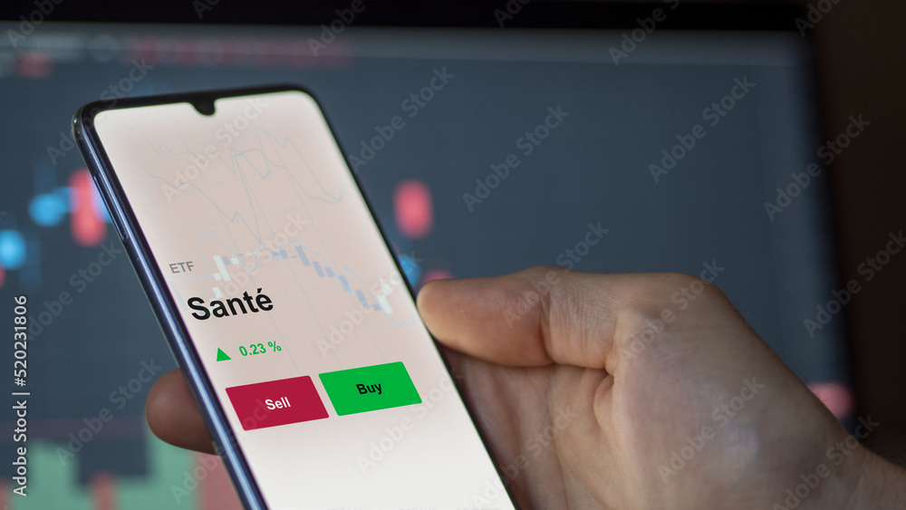 Un investisseur analyse un fonds etf santé sur un graphique. Un téléphone affiche le cours de l'ETF. Texte en français francais Santé Un investisseur analyse un fonds etf santé sur un graphique. Un téléphone affiche le cours de l'ETF. Texte en français francais Santé