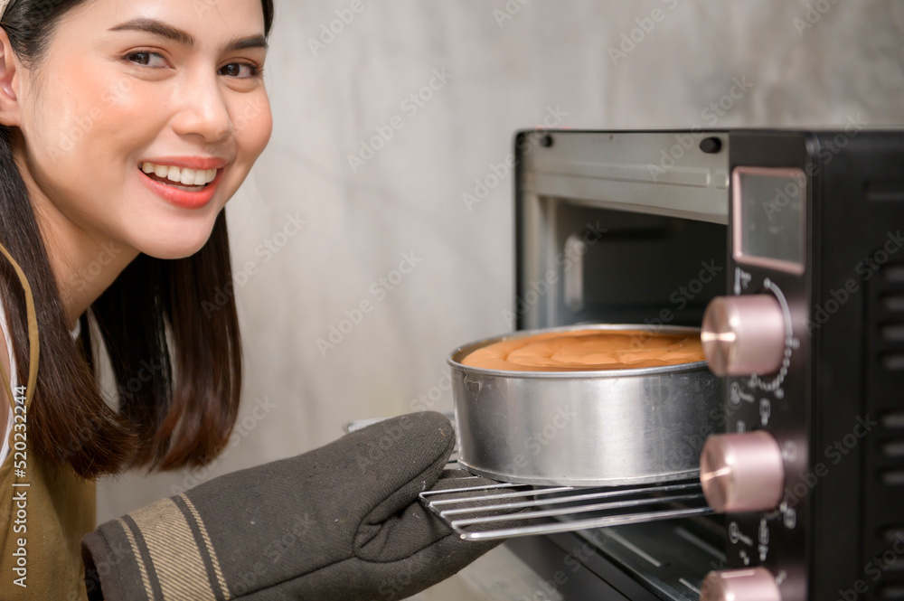 Young beautiful woman is baking in her kitchen , bakery and coffee shop business Young beautiful woman is baking in her kitchen , bakery and coffee shop business