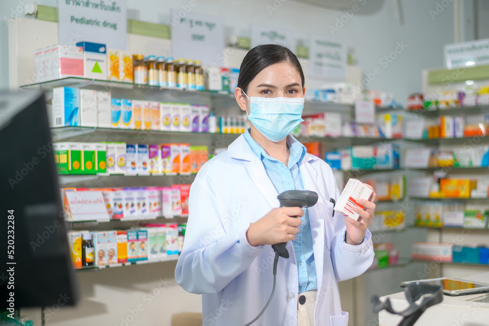 Portrait of female pharmacist wearing face mask in a modern pharmacy drugstore. Portrait of female pharmacist wearing face mask in a modern pharmacy drugstore.
