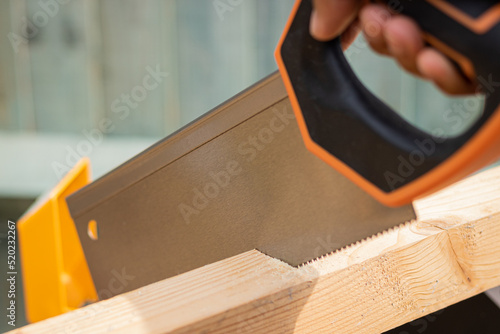 Obraz na plátne close up of tenon saw blade cutting wood