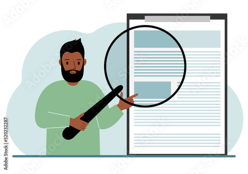 A man holds a magnifying glass and examines a document, contract or agreement. The concept of a lawyer, businessman, or attorney at work.