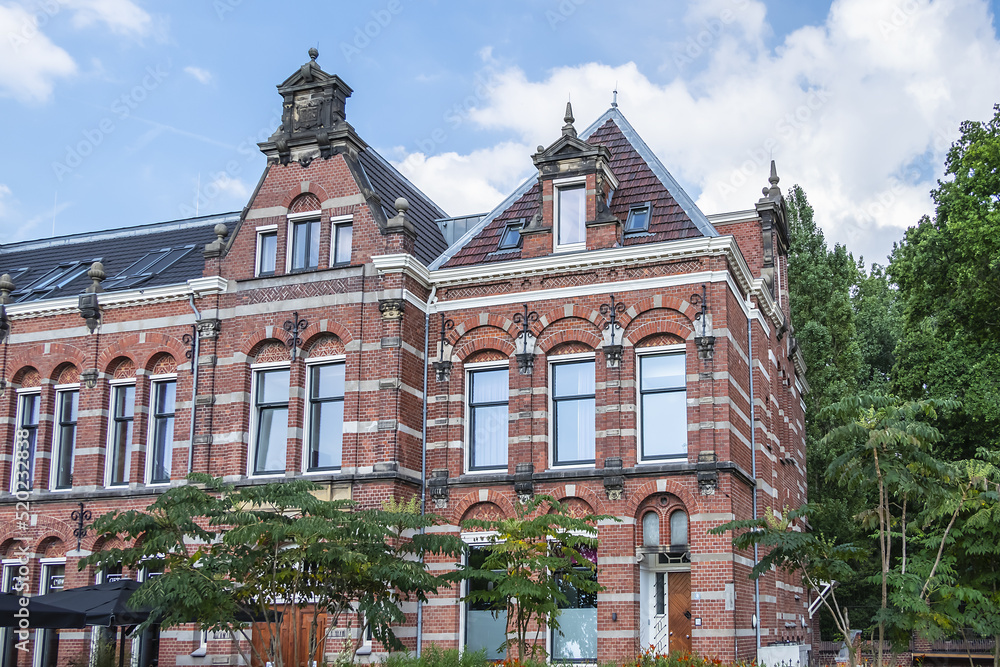 Original, monumental building was once office of Westergasfabriek used to be a factory all those years ago and was constructed in 1885 so as to produce gas. Westerpark, Amsterdam, the Netherlands. Original, monumental building was once office of Westergasfabriek used to be a factory all those years ago and was constructed in 1885 so as to produce gas. Westerpark, Amsterdam, the Netherlands.