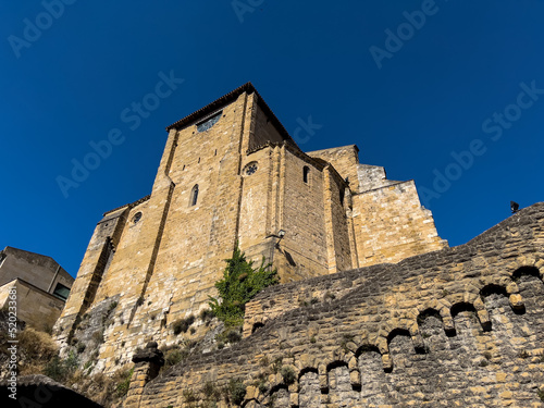 Fototapeta looking up at a religious building built on rock foundations