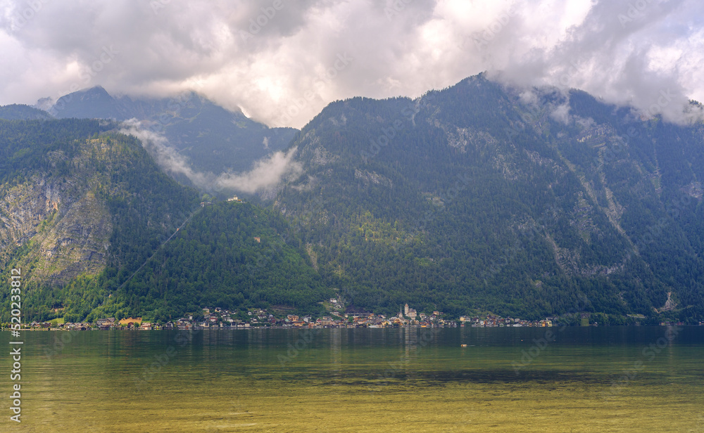 Panoramic view of the famous old town of Hallstatt and the deep blue lake on a fine Saturday with beautiful sunlight in summer, Salzkammergut, Austria