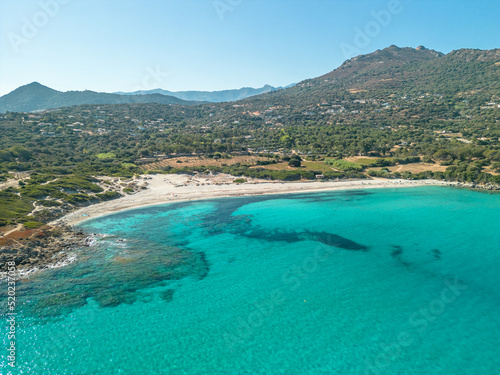 Aerial view of the clear turquoise Mediterranean sea at Bodri beach in the Balagne region of Corsica
