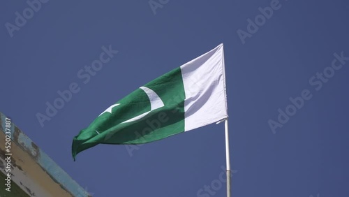 Pakistan flag waving. Recorded in slow motion. Green and white