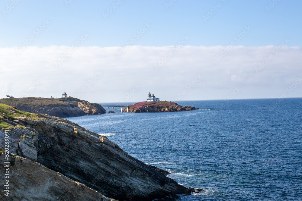 Northern Spain beach, beautiful sea, next to cliffs and rocks on the shore
