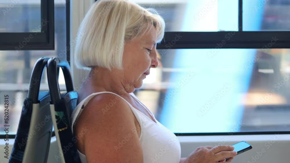 Happy caucasian senior female tourist in modern high speed train