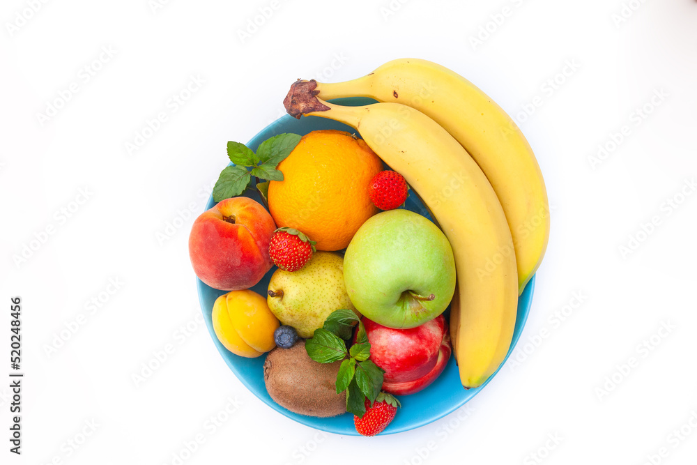 Bright juicy fruits laid out in a plate - blueberries, bananas, pears, apples, mint Bright juicy fruits laid out in a plate - blueberries, bananas, pears, apples, mint