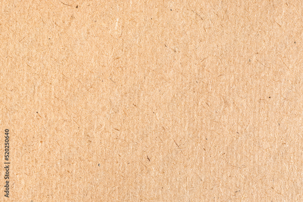 paper background - textured surface of old brown cardboard close up paper background - textured surface of old brown cardboard close up