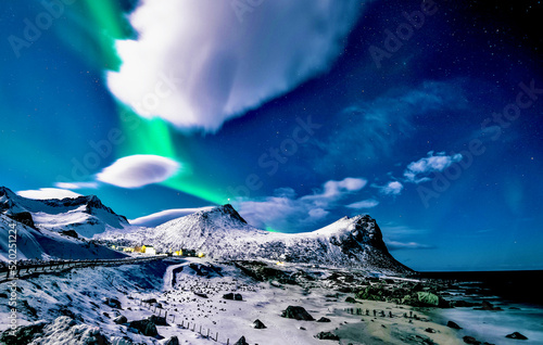 mountains with aurora in winter
