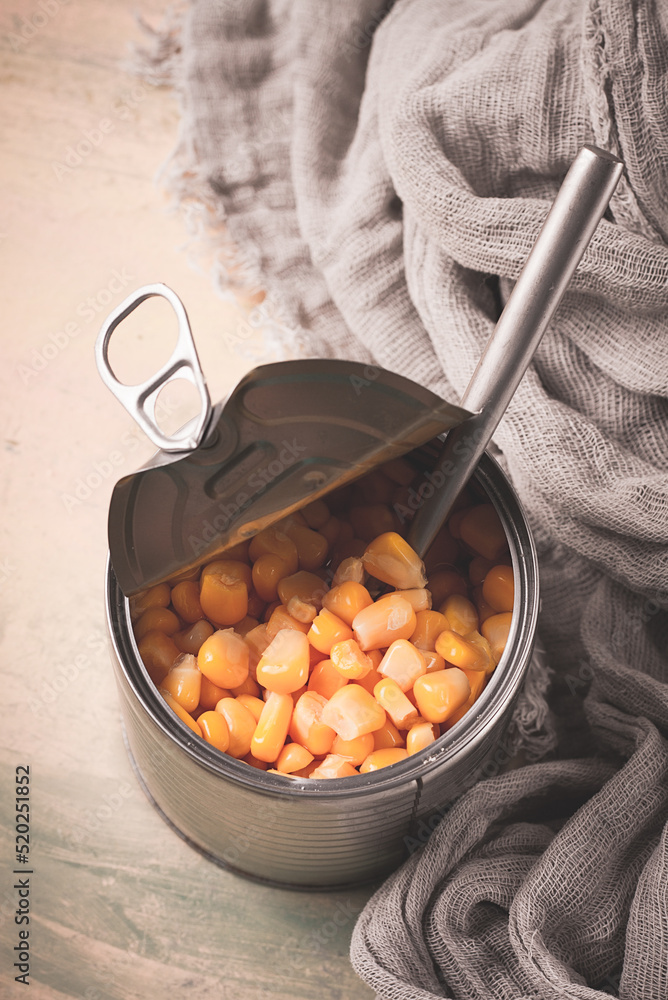Fototapeta premium Open tin can, with corn, top view, selective focus, no people, close-up,