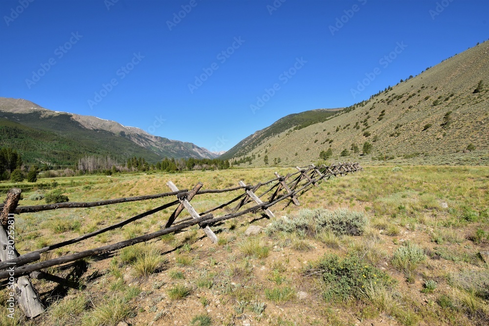 Fence in mountain valley
