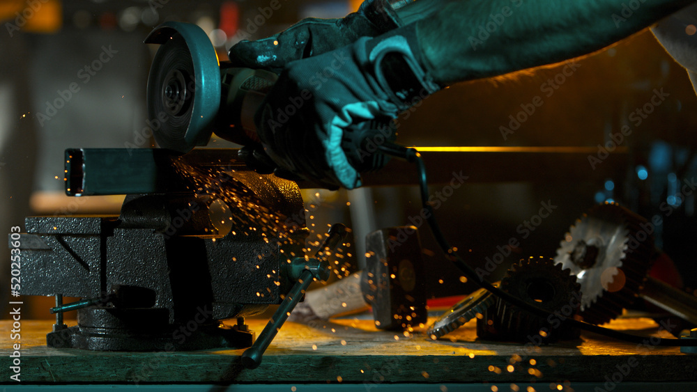 Working Metal Cutter in Workshop. Detail shot, low depth of focus. Working Metal Cutter in Workshop. Detail shot, low depth of focus.