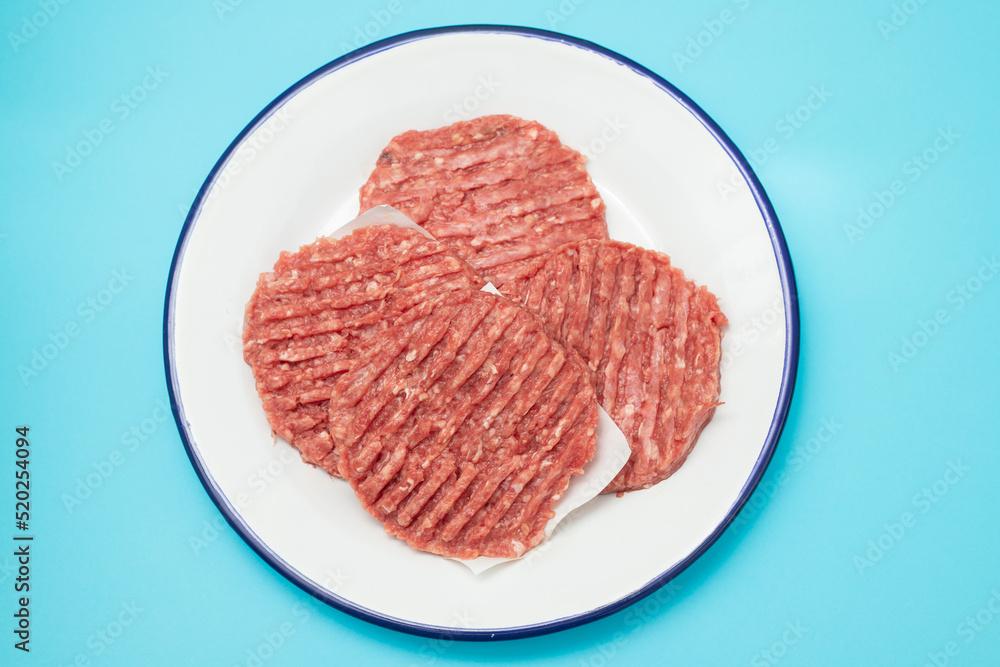 fresh raw minced meat on white dish with paper fresh raw minced meat on white dish with paper