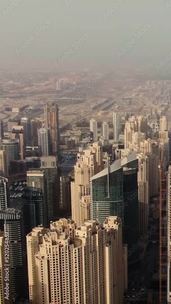 Vertical panning from a quadcopter. Aerial shot of beach and skyscrapers, Dubai. Vertical panning from a quadcopter. Aerial shot of beach and skyscrapers, Dubai.
