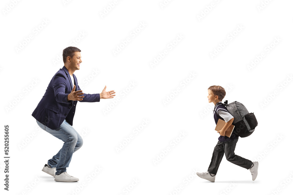 Full length profile shot of a schoolboy running to hug his father Full length profile shot of a schoolboy running to hug his father