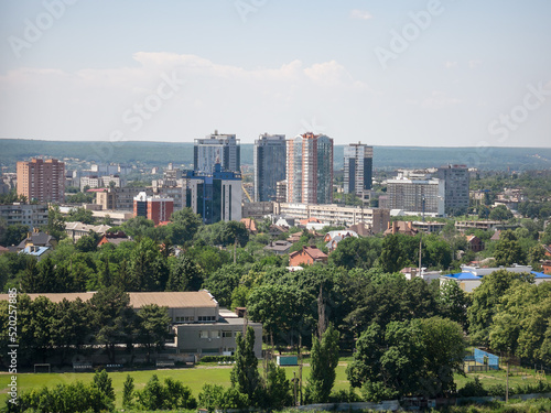 Cityscape of a part of the city with a stadium, on a sunny summer day. Ukraine, Kharkiv