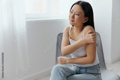 Suffering from neuralgia after sleeping in the wrong position tanned beautiful young Asian woman touching painful shoulder at home living room. Injuries Poor health Illness concept. Cool offer Banner Free Download Suffering from neuralgia after sleeping in the wrong position tanned beautiful young Asian woman touching painful shoulder at home living room. Injuries Poor health Illness concept. Cool offer Banner - GFXLoad
