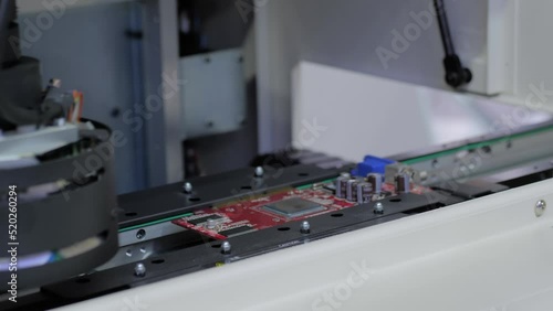 Automated visual optical inspection system for quality control of printed circuit board - close up view. Measurement, industrial, robotic, production, technology and manufacturing concept photo