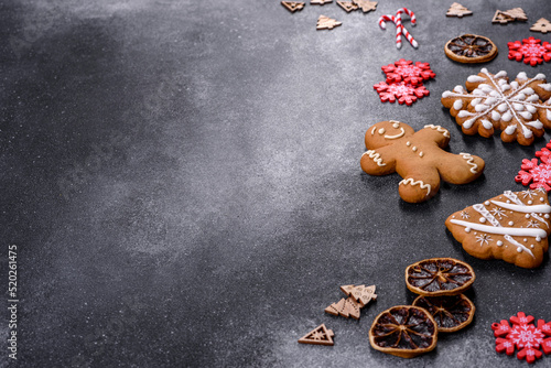 Christmas homemade gingerbread cookies on a dark concrete table