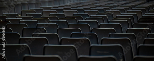 Countless black chairs in set in pattern