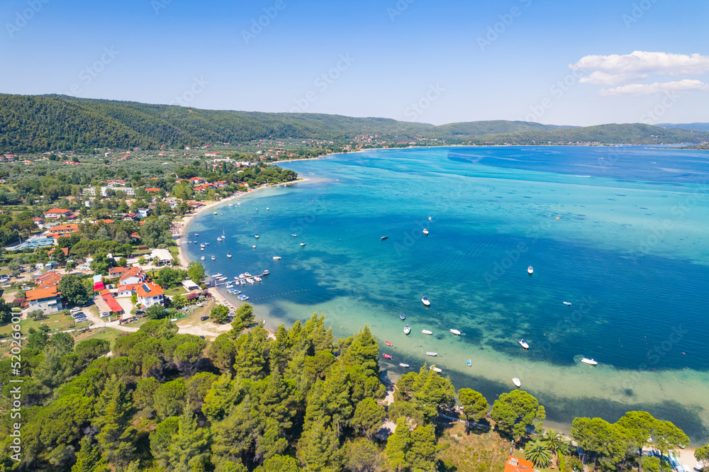 Halkidiki Peninsula, Greece. Amazing breathtaking Greek Karydi Beach seen from aerial drone view. Shallow sea water in amazing turquoise color. High quality photo