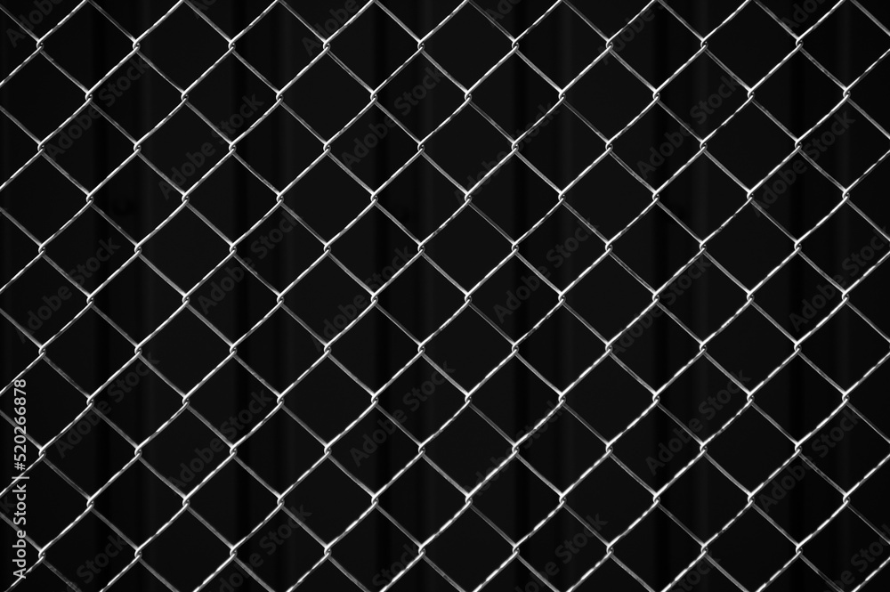 metal mesh,in the photo a mesh on a gray background metal mesh,in the photo a mesh on a gray background