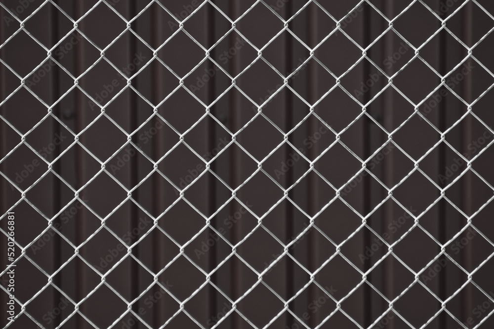 metal mesh,in the photo a mesh on a gray background metal mesh,in the photo a mesh on a gray background