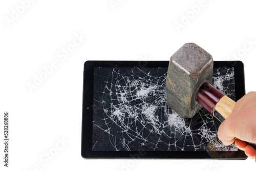 Close up view of man's hand crashing tablet with sledgehammer isolated on white background.