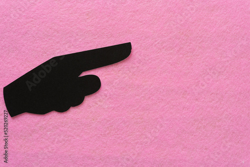 pictographic glyph (hand with pointing finger) on pink felt photo