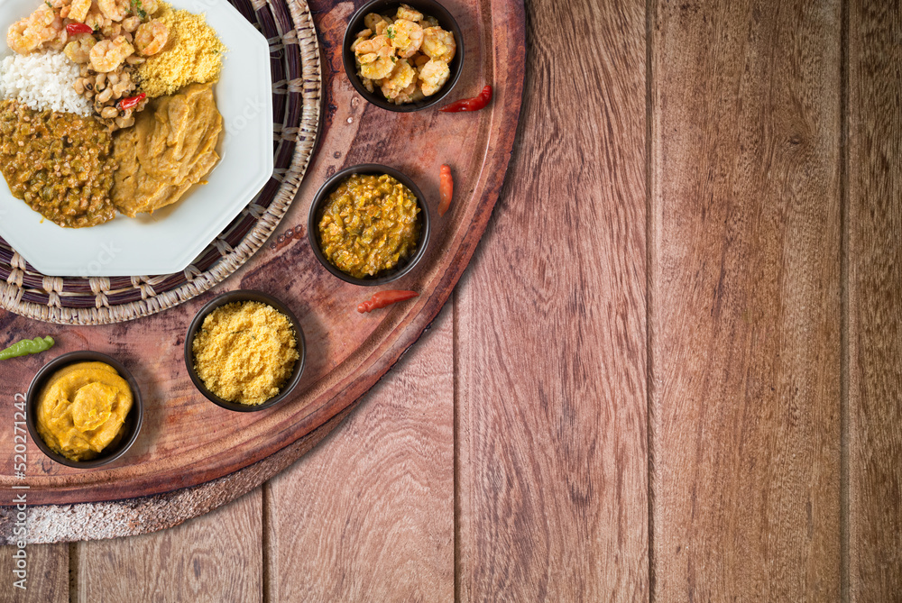 Caruru. Traditional Afro-Brazilian dish made with okra and dried shrimp, accompanied by vatapa, beans, rice, shrimp and farofa. Caruru. Traditional Afro-Brazilian dish made with okra and dried shrimp, accompanied by vatapa, beans, rice, shrimp and farofa.