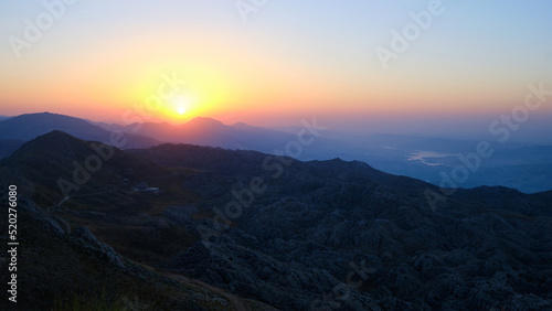 Sun rising above mountain range. Scenic view of sunrise in a mountainside. Nemrut Dagi National Park, Adiyaman province, Turkiye