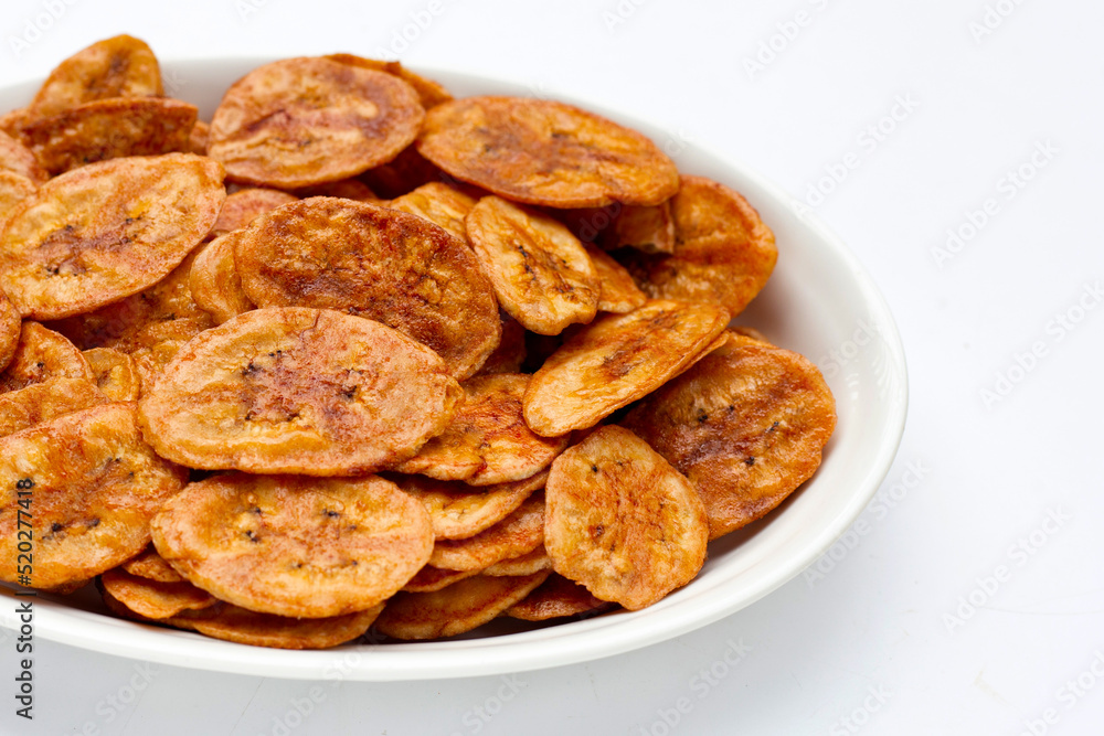 Banana chips on white background Banana chips on white background