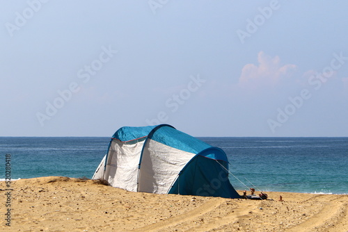 Tent for rest on the shores of the Mediterranean Sea.