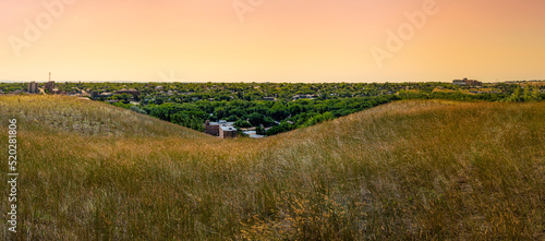 Perrier hills at sunset over Medicine Hat city in Alberta, Canada photo