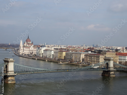 aerial cityscape view of budapest showing the parliament and historic buildings along the river danube with he historic chain bridge in the foreground