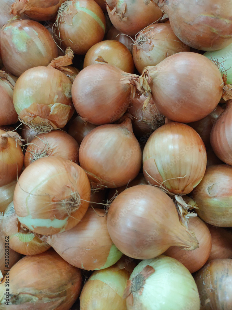A collection of fresh onions at the supermarket