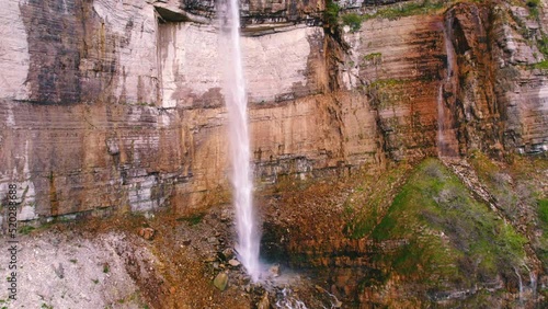 Scenic drone shot of a high cliff with an enormous waterfall, Okatse, Georgia, Europe. High quality 4k footage photo