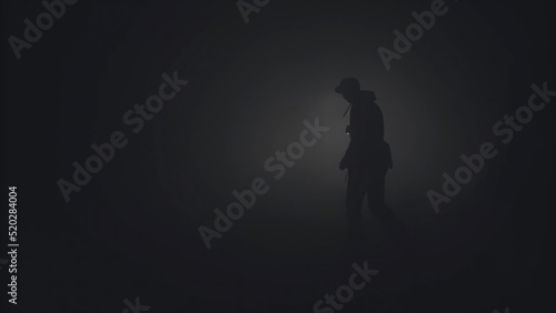 Silhouette of man in thick fog. Stock footage. Black silhouette of man with flashlight shining in thick grey smoke. Man with flashlight makes his way through darkness in smoke