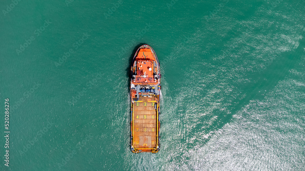 Aerial view on top of cargo ship carrying container and running for export cargo yard port to international custom ocean. Concept of technology transportation , customs clearance, webinar banner.