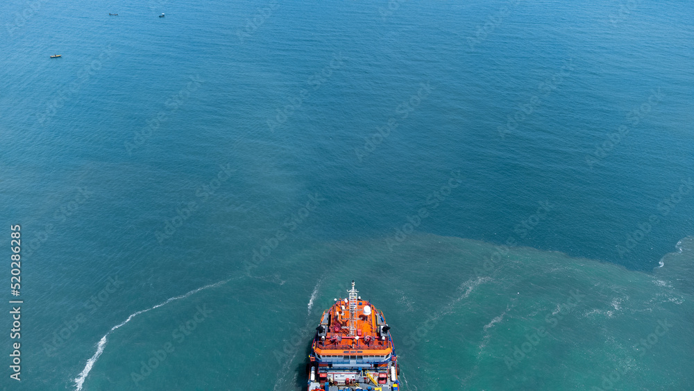 Aerial view on top of cargo ship carrying container and running for export cargo yard port to international custom ocean. Concept of technology transportation , customs clearance, webinar banner.