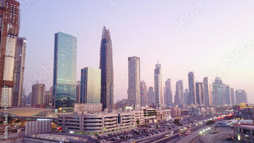 Beautiful aerial view with sky from top to sunrise and city futuristic skylines buildings and infrastructure. Dubai  United Arab Emirates. Top view of Dubai at sunrise