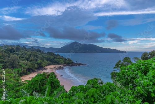 Fototapeta Naklejka Na Ścianę i Meble -  Colourful Skies Sunset over Head Laem Sing Beach in Phuket Thailand. This Lovely island waters are turquoise blue waters, lush green mountains colourful skies and beautiful views of Pa Tong Patong