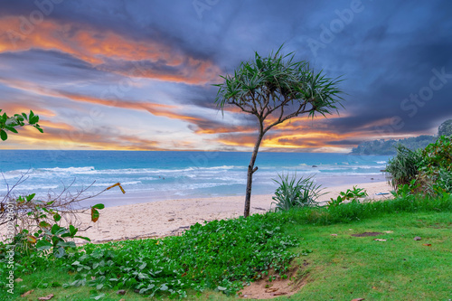 Colourful Skies Sunset over Surin Beach in Phuket Thailand. This Lovely island waters are turquoise blue waters, lush green mountains colourful skies and beautiful views of Pa Tong Patong