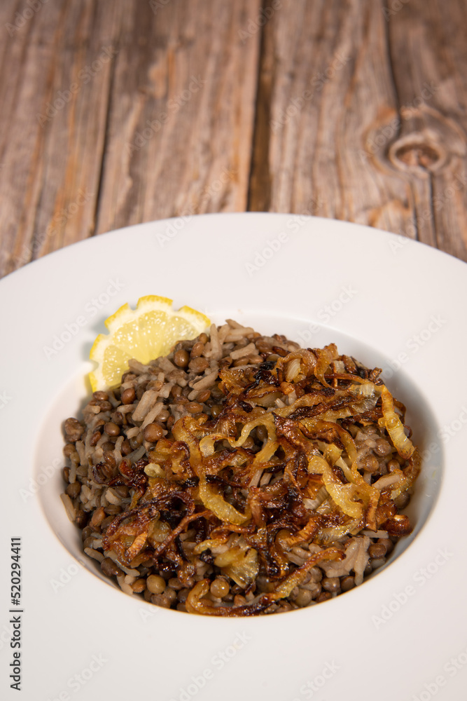 VEGAN LEBANESE LENTILS WITH GOLDEN ONIONS AND RICE RECIPE , MDARDARA B'RIZ. High quality photo VEGAN LEBANESE LENTILS WITH GOLDEN ONIONS AND RICE RECIPE , MDARDARA B'RIZ. High quality photo